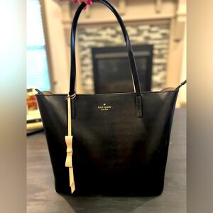 KATE SPADE large tote. Black with beige trim and beige liner. Top zip closure.